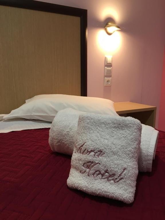 Postel nebo postele na pokoji v ubytování Hotel Avra