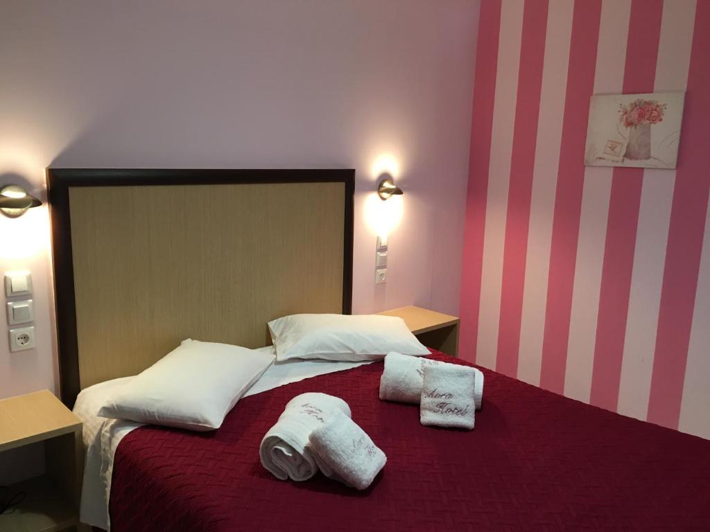 Postel nebo postele na pokoji v ubytování Hotel Avra