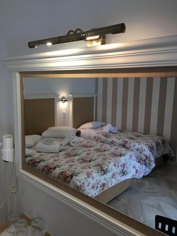 Postel nebo postele na pokoji v ubytování Hotel Avra