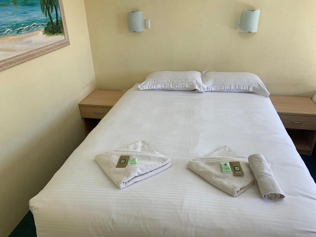Postel nebo postele na pokoji v ubytování John Oxley Motel
