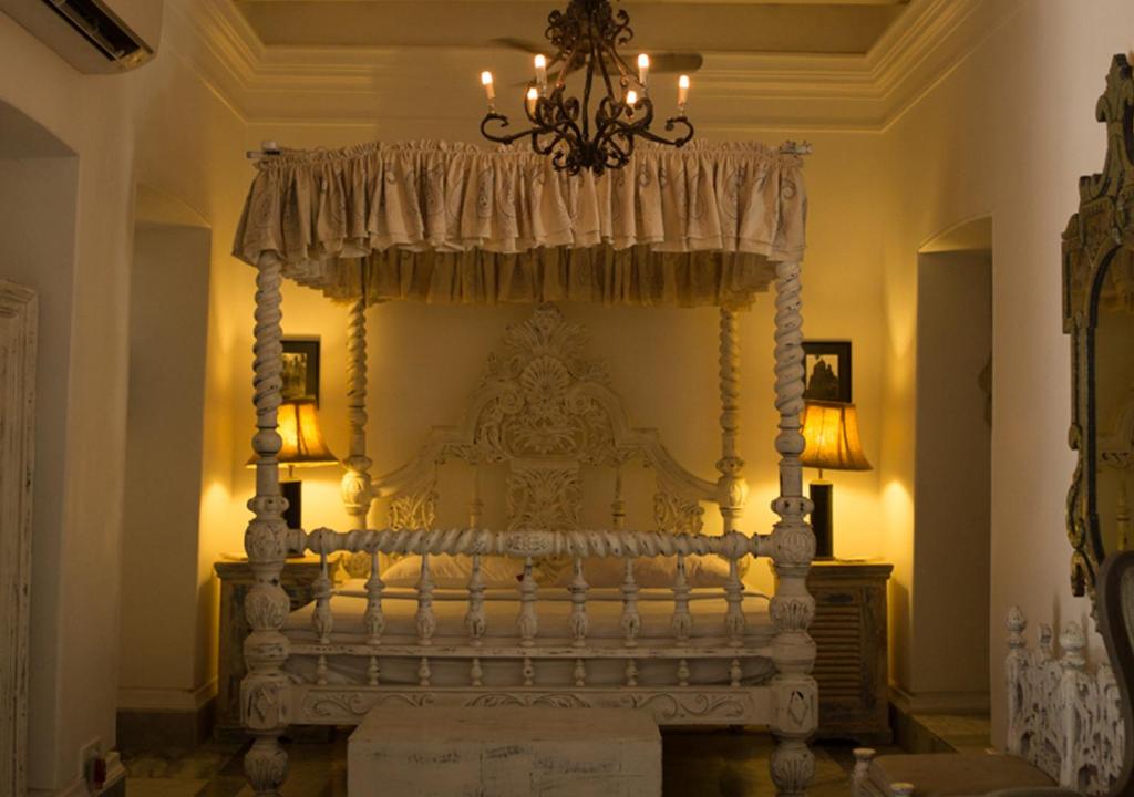 Postel nebo postele na pokoji v ubytování The Rajbari Bawali