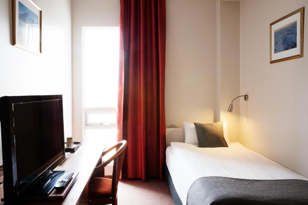 TV a/nebo společenská místnost v ubytování Fosshotel Baron
