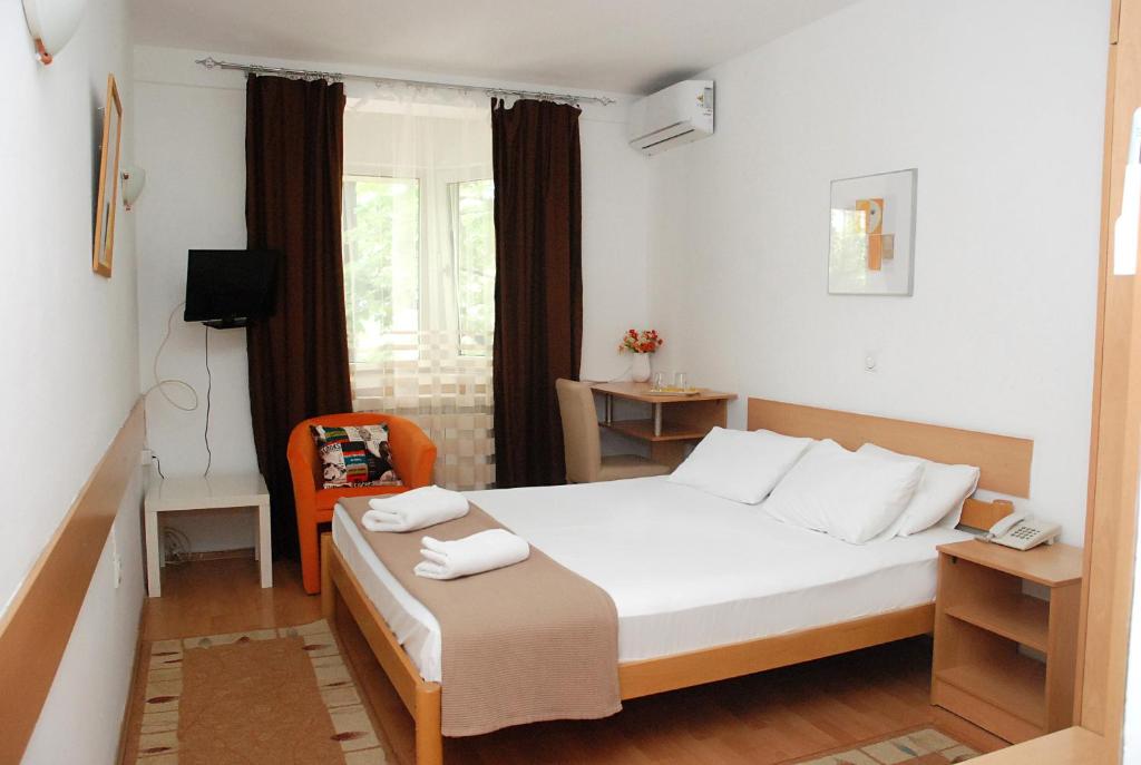 Postel nebo postele na pokoji v ubytování Hotel 7