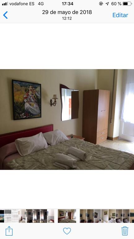 Postel nebo postele na pokoji v ubytování Hotel Comodoro
