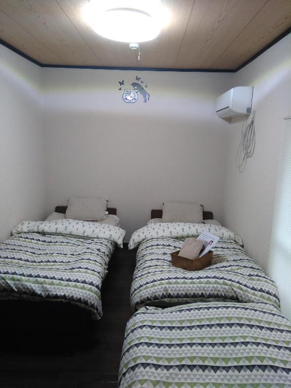 Postel nebo postele na pokoji v ubytování MIROKU Share House