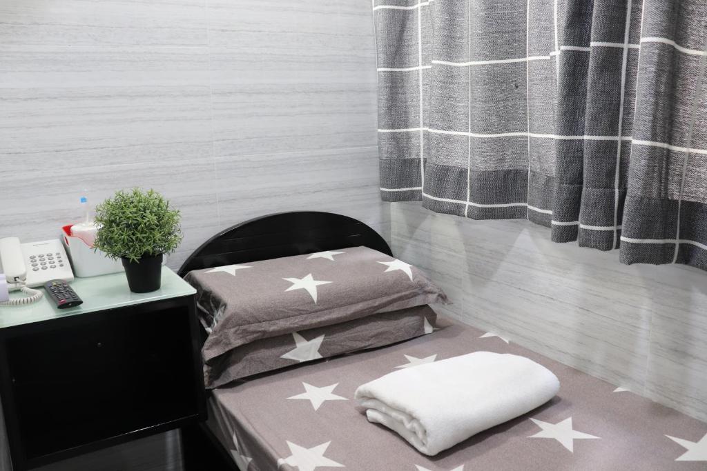 Postel nebo postele na pokoji v ubytování Super Guest House