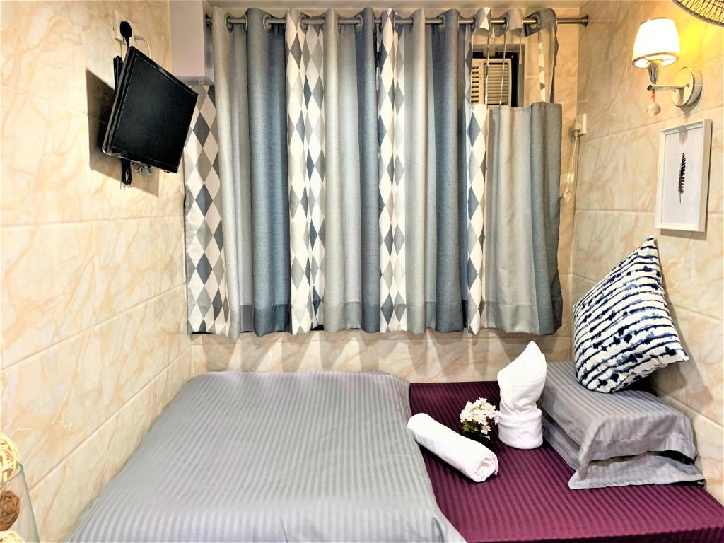 Postel nebo postele na pokoji v ubytování Super Guest House