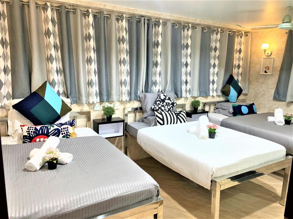 Postel nebo postele na pokoji v ubytování Super Guest House