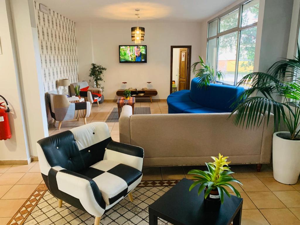 TV a/nebo společenská místnost v ubytování Hotel Real