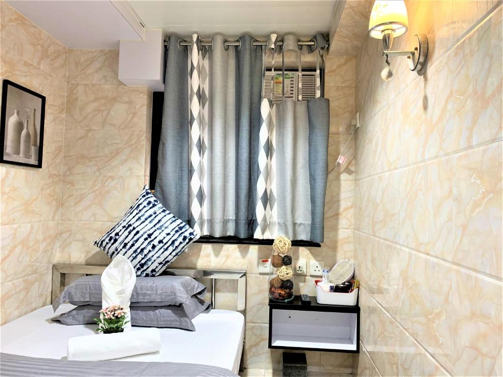 Postel nebo postele na pokoji v ubytování Super Guest House