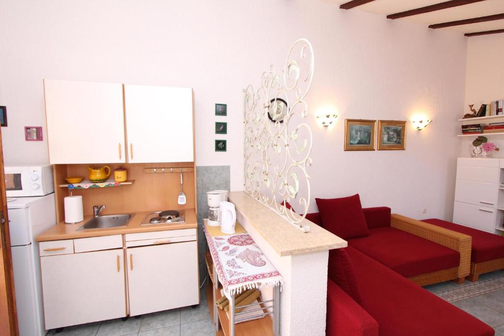 Kuchyň nebo kuchyňský kout v ubytování Apartments Villa Lucu