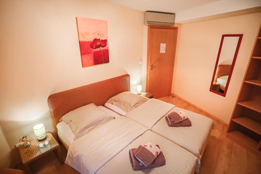 Postel nebo postele na pokoji v ubytování B&B Relais du Vigneron - Jean-Luc et Bruno Meyer
