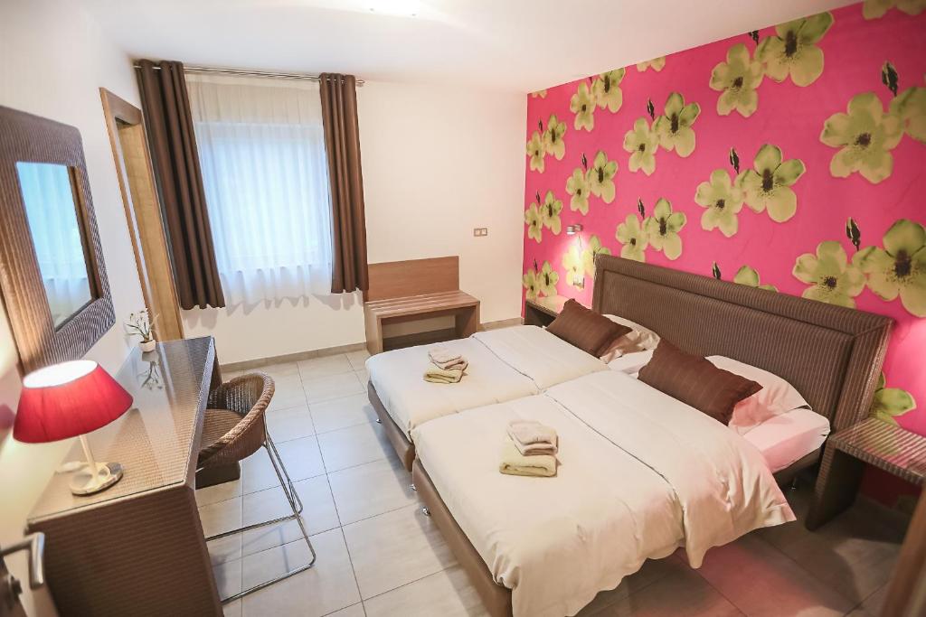 Postel nebo postele na pokoji v ubytování B&B Relais du Vigneron - Jean-Luc et Bruno Meyer