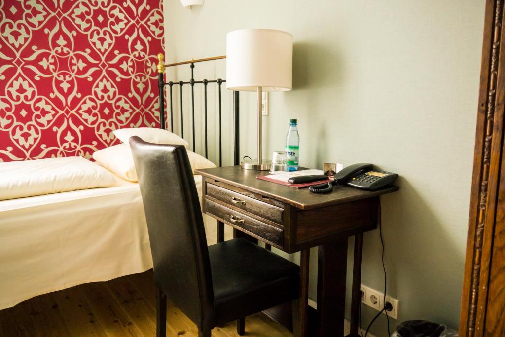 Postel nebo postele na pokoji v ubytování Hotel Alexander