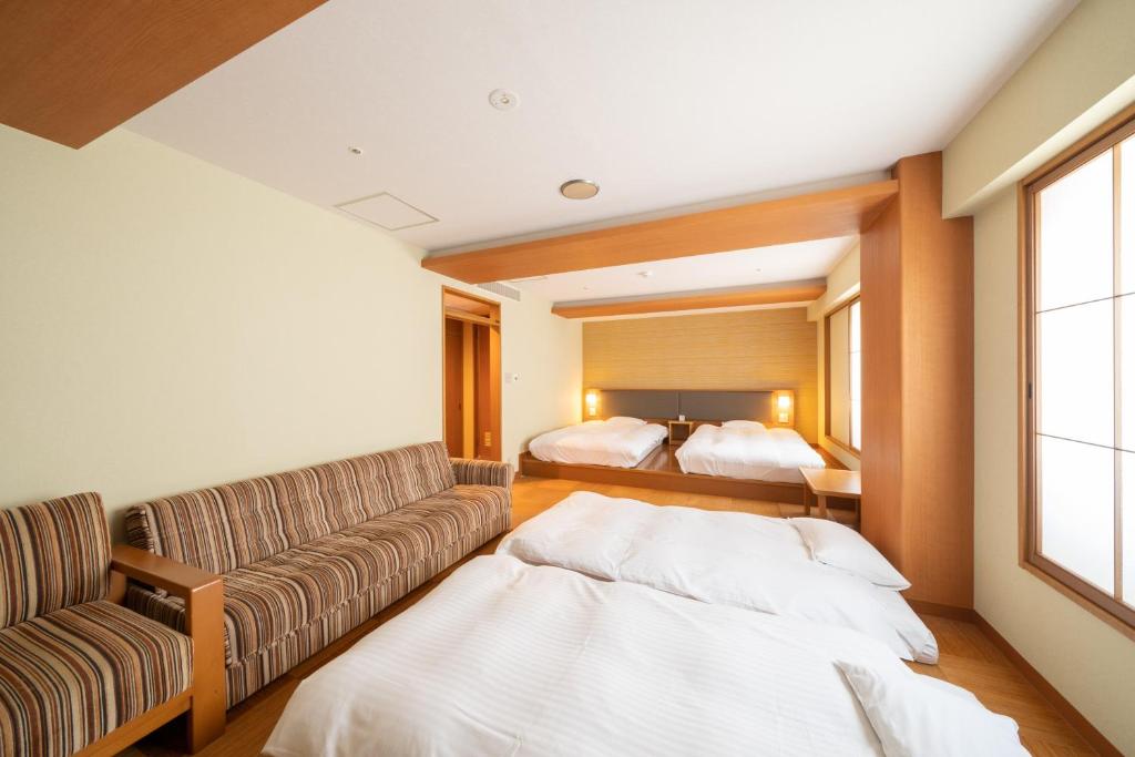 Postel nebo postele na pokoji v ubytování Pearl Hotel Ryogoku