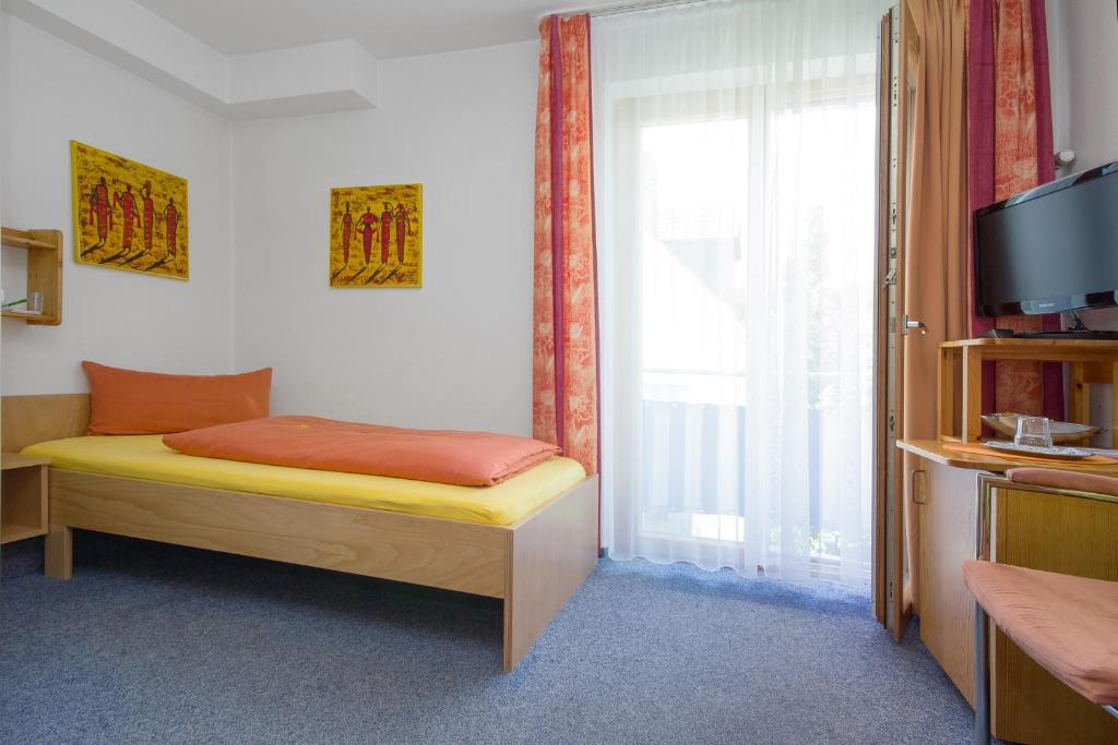 Postel nebo postele na pokoji v ubytování Apart Hotel Stadtgarten