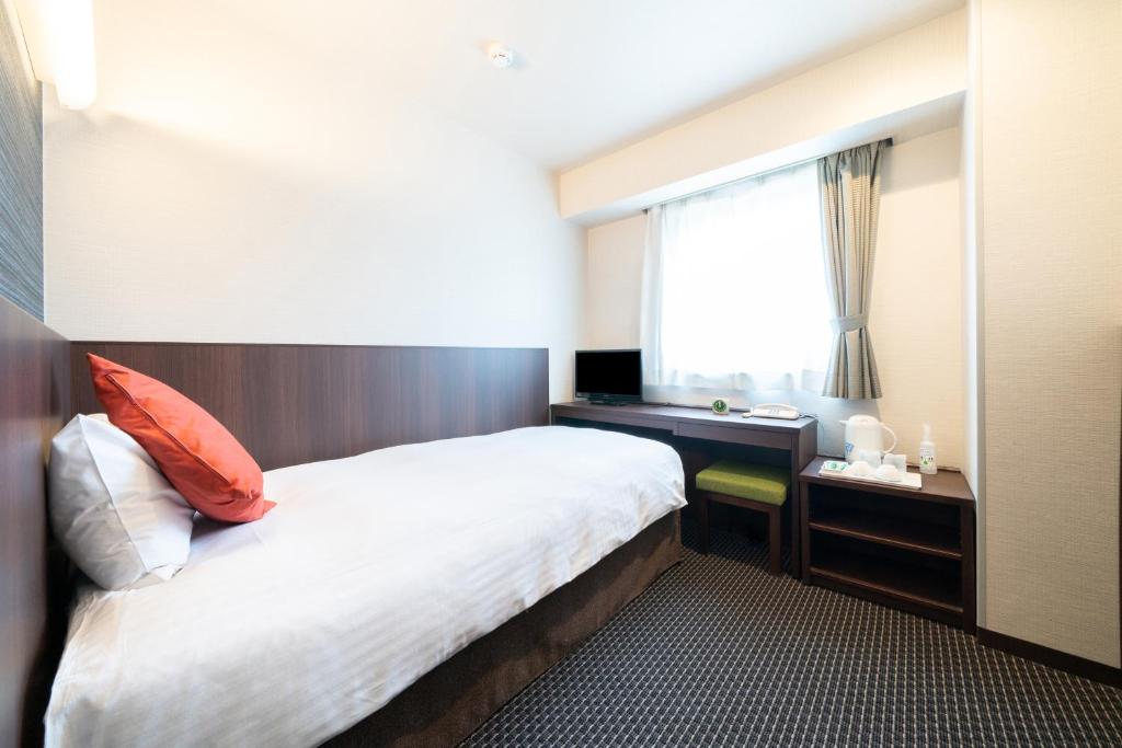 Postel nebo postele na pokoji v ubytování Pearl Hotel Ryogoku