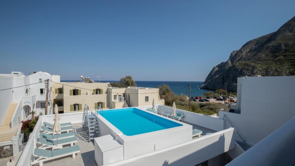 a view of a villa with a swimming pool at Zacharakis Studios in Kamari