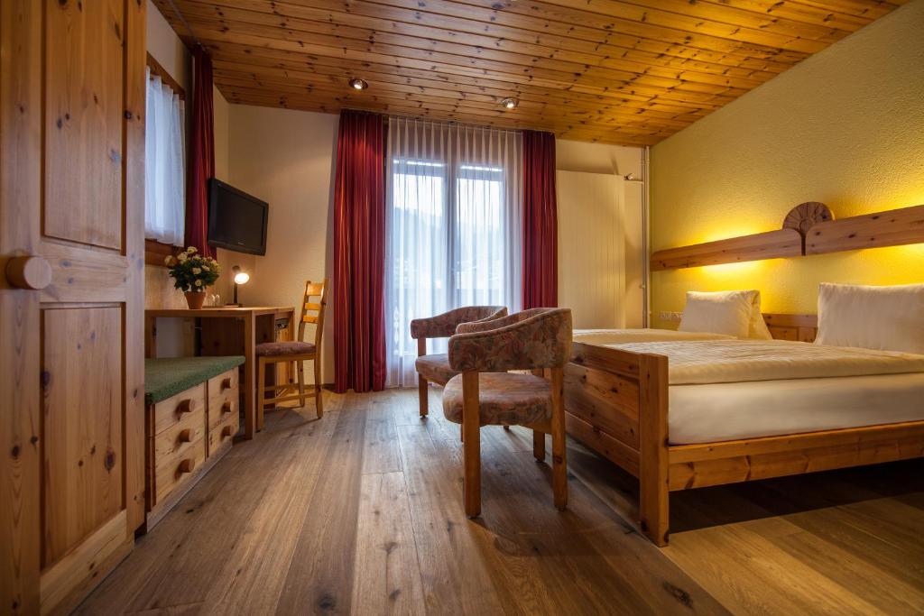 Postel nebo postele na pokoji v ubytování Hotel Astoria