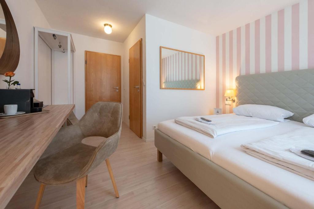 Postel nebo postele na pokoji v ubytování Hotel Am Dom