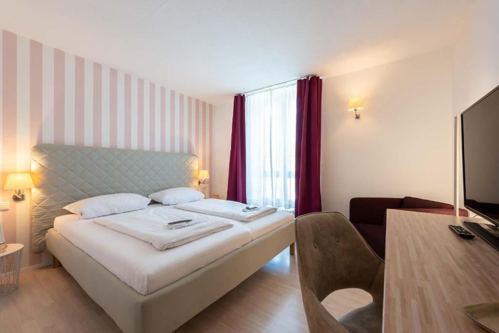 Postel nebo postele na pokoji v ubytování Hotel Am Dom