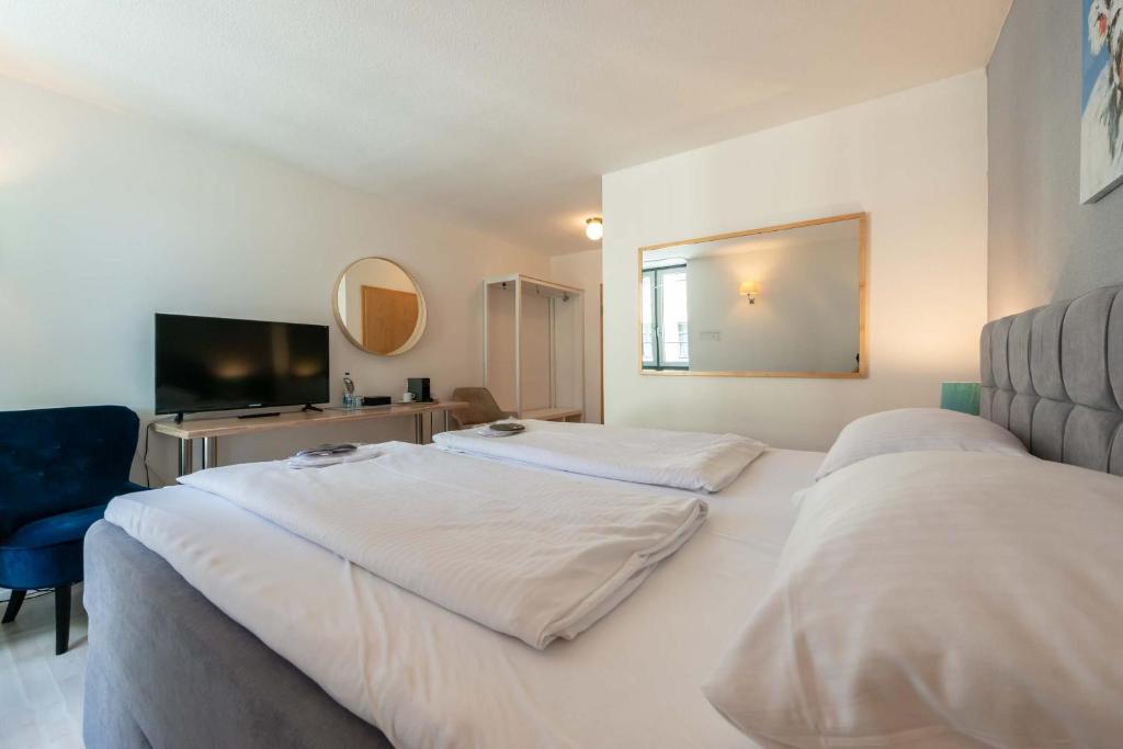 Postel nebo postele na pokoji v ubytování Hotel Am Dom