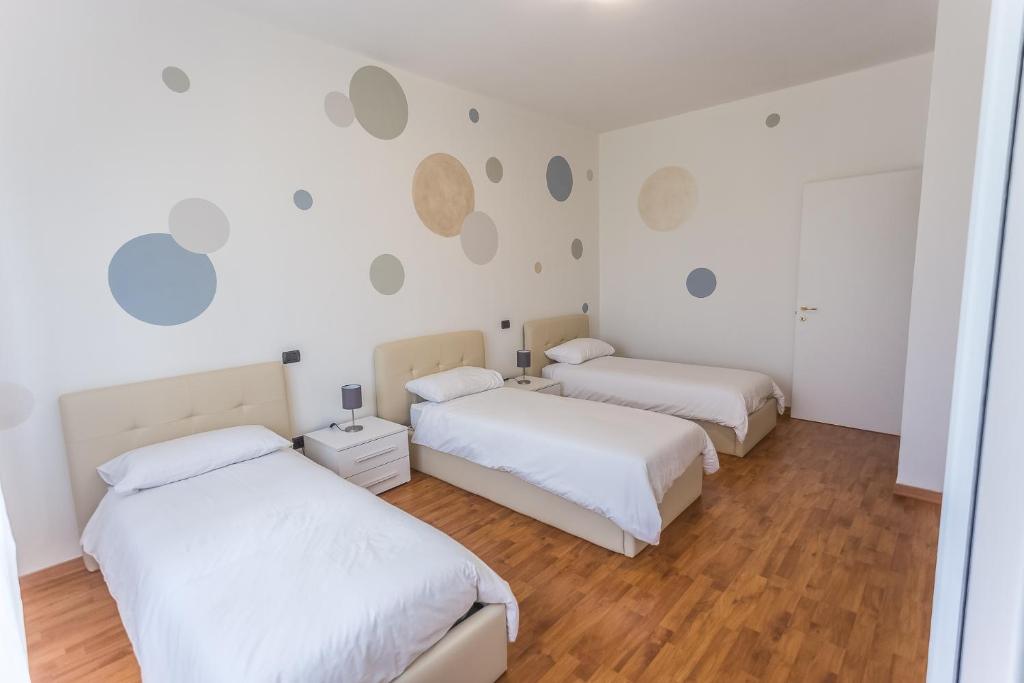 Postel nebo postele na pokoji v ubytování LM House