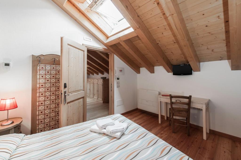 Postel nebo postele na pokoji v ubytování Albergo Parigi