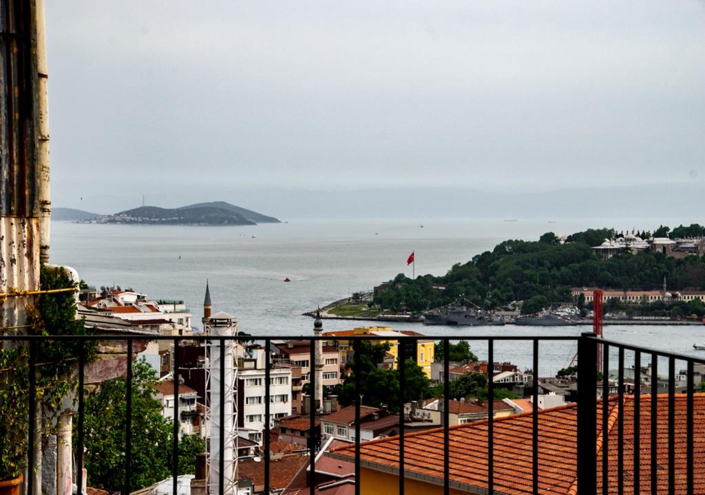 a large body of water with a boat in the distance at ROYAL TAKSIM SUITES in Istanbul