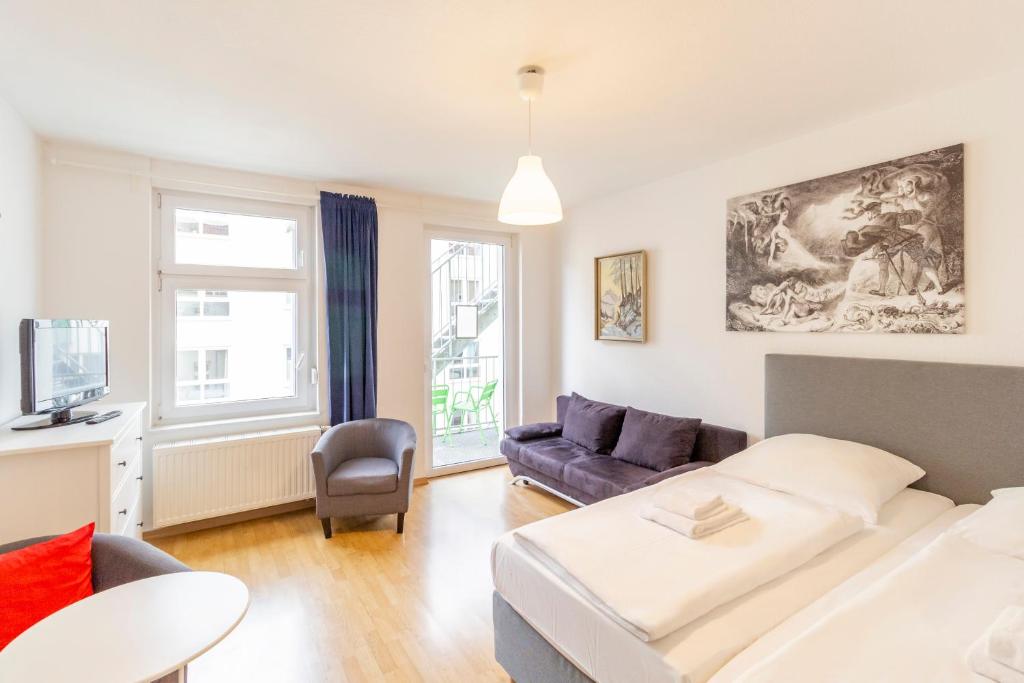 Postel nebo postele na pokoji v ubytování Hotel Markgraf Leipzig