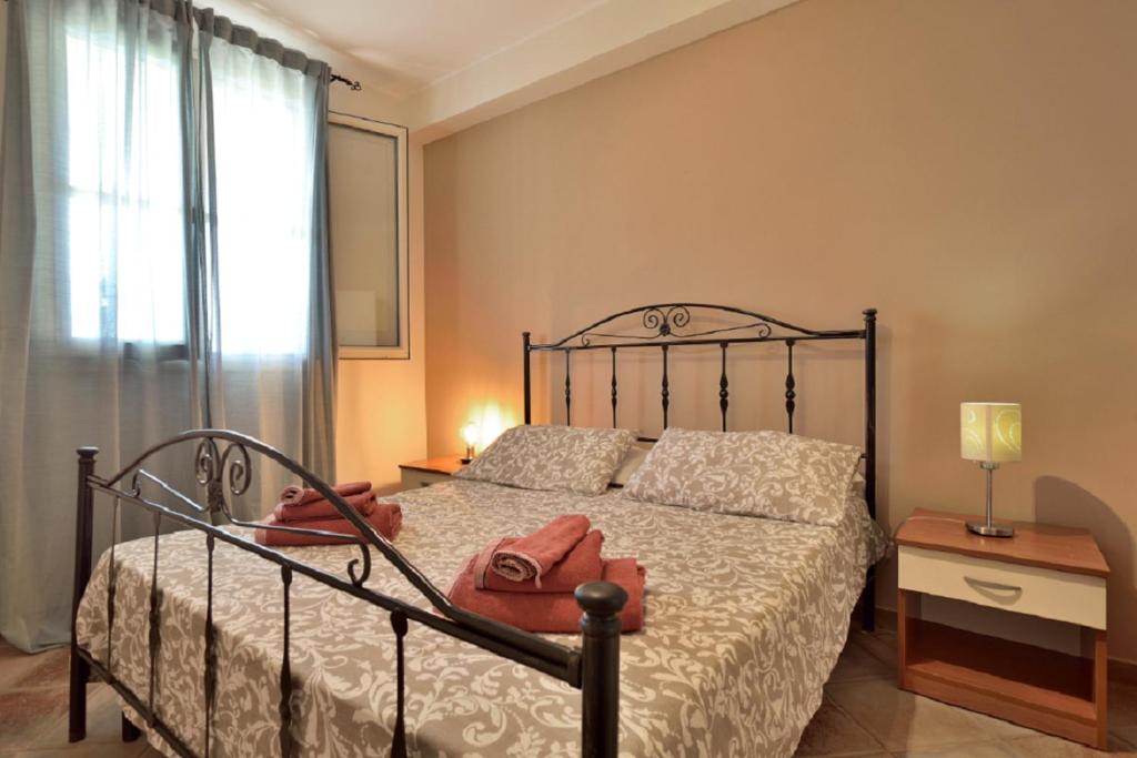 Postel nebo postele na pokoji v ubytování LA DIGA - Bilocale a Marzamemi, fronte mare