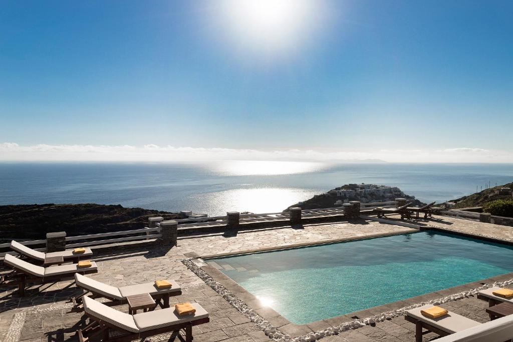 a swimming pool with a view of the ocean at Gerofinikas Boutique Hotel in Apollonia