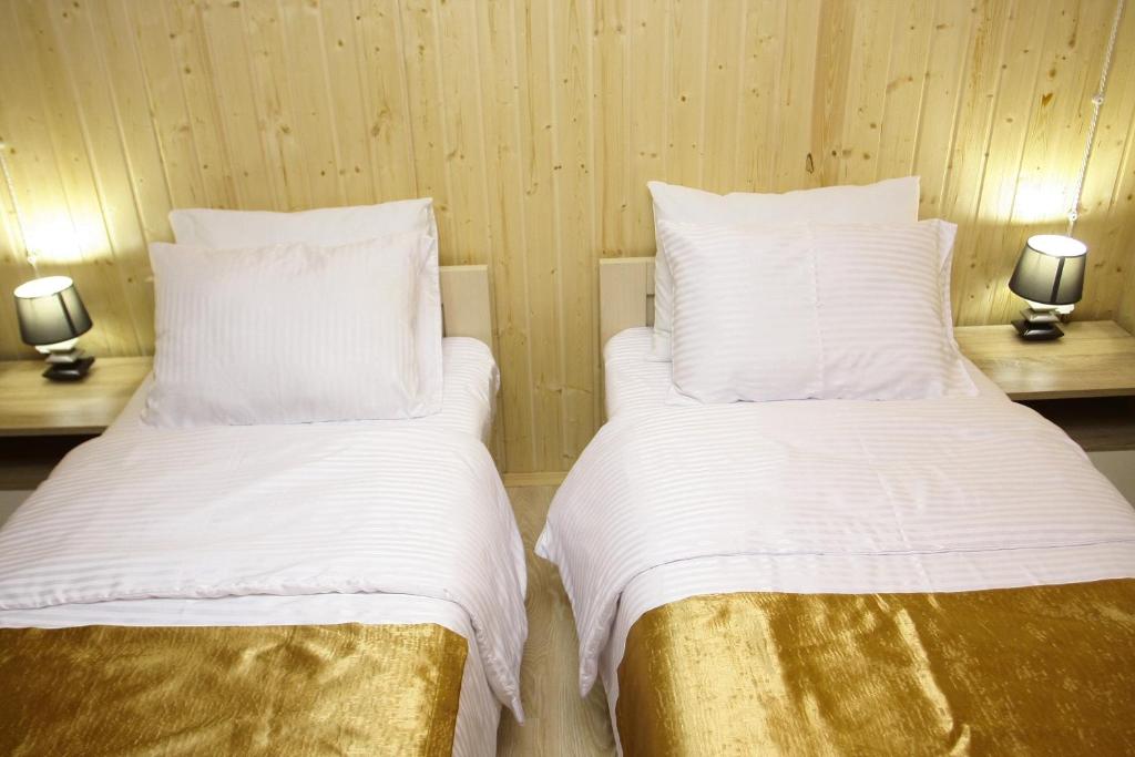 Postel nebo postele na pokoji v ubytování Park Hotel Kutaisi