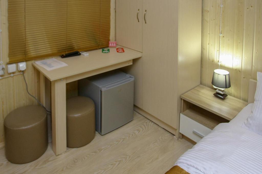 Postel nebo postele na pokoji v ubytování Park Hotel Kutaisi