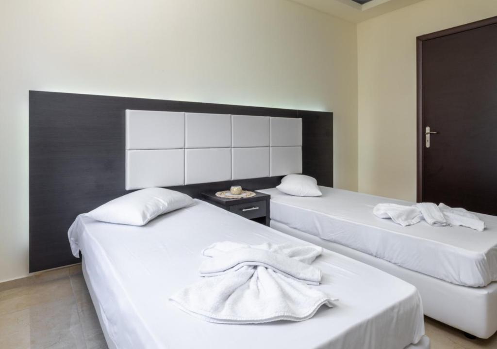 Кровать или кровати в номере Villa Antonis deluxe apartments