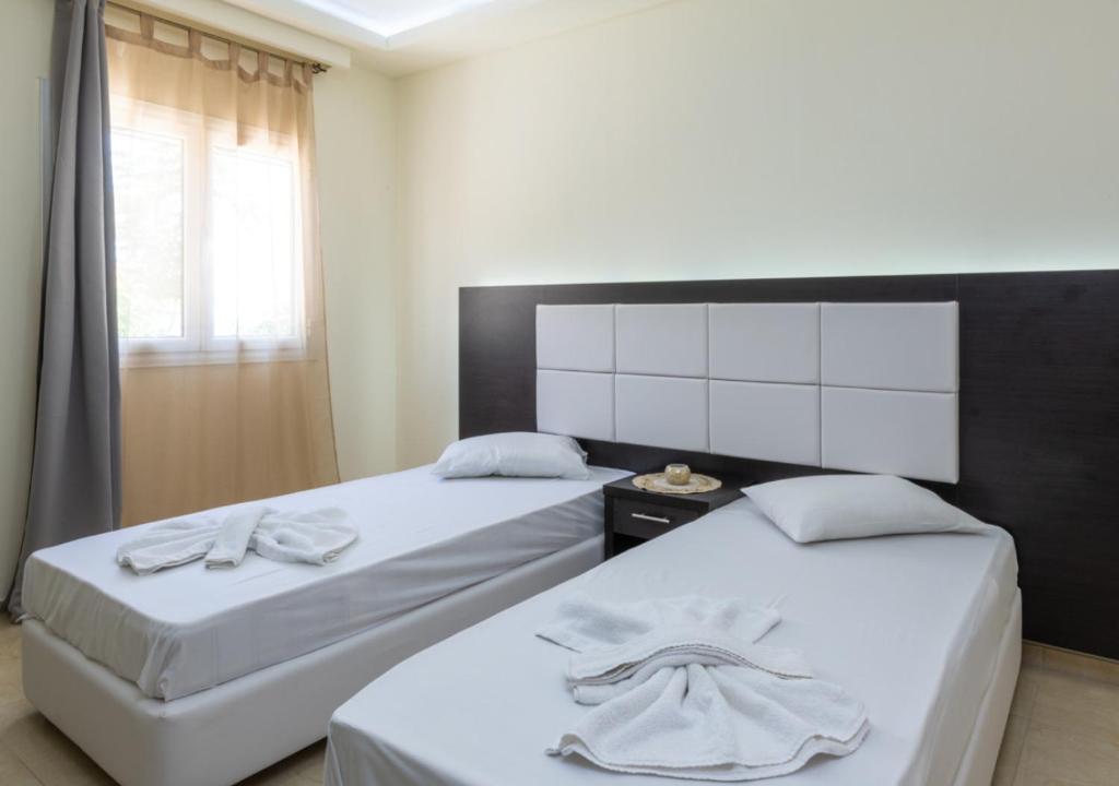 Кровать или кровати в номере Villa Antonis deluxe apartments