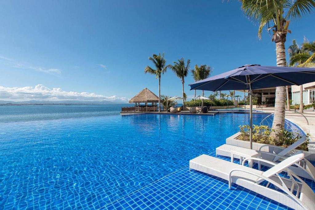 Bazén v ubytování Dusit Thani Mactan Cebu Resort nebo v jeho okolí