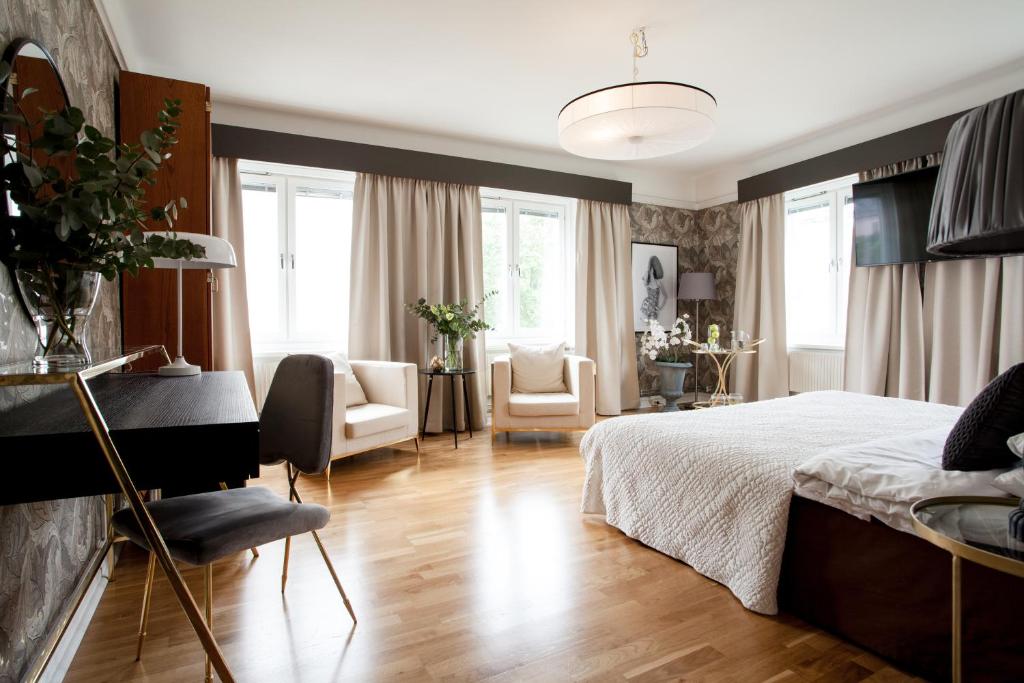 Postel nebo postele na pokoji v ubytování Centric Hotel