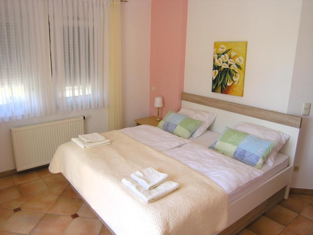 Posteľ alebo postele v izbe v ubytovaní Apartments Kristina