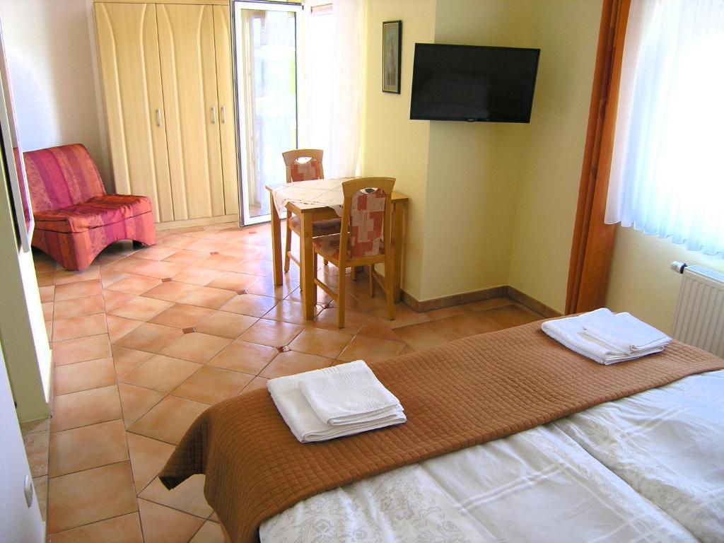 Posteľ alebo postele v izbe v ubytovaní Apartments Kristina