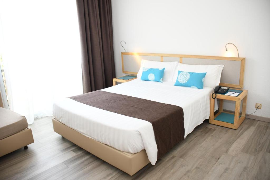 Postel nebo postele na pokoji v ubytování Baia di Conte Resort