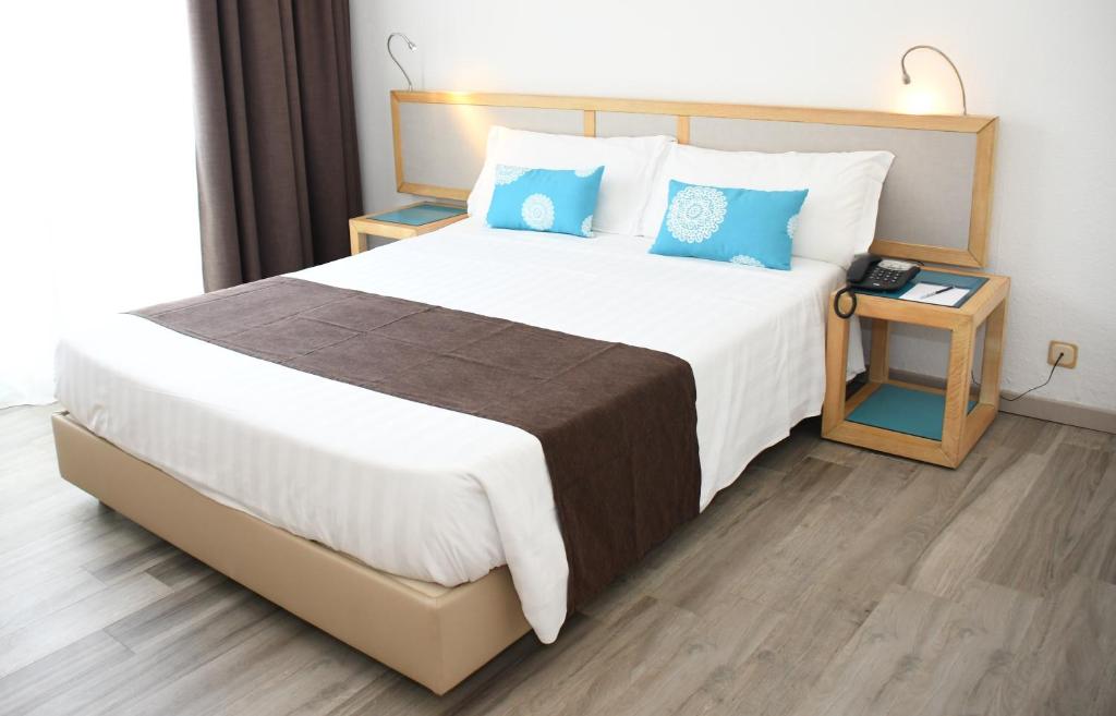 Postel nebo postele na pokoji v ubytování Baia di Conte Resort