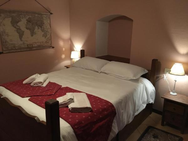A bed or beds in a room at maison terme relax