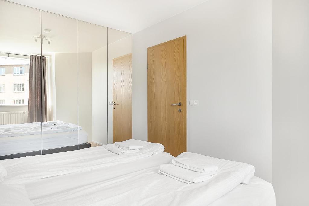 Postel nebo postele na pokoji v ubytování Stay Apartments Einholt
