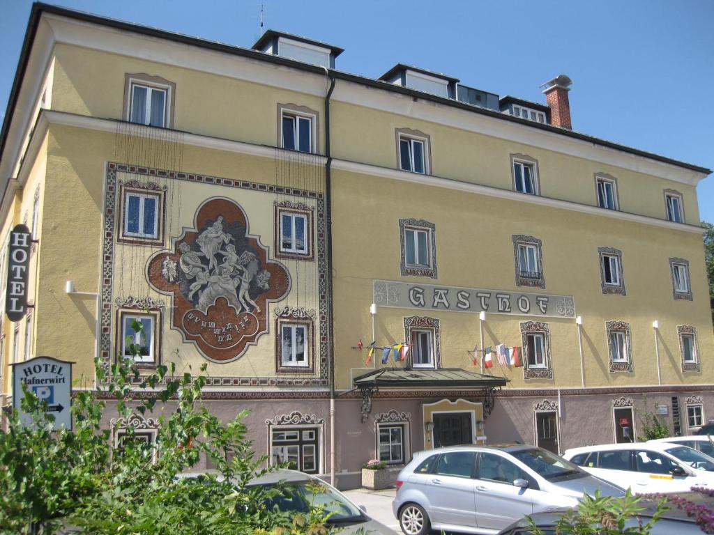 a large building with a sign on the front of it at Hotel Hafnerwirt in Hallein