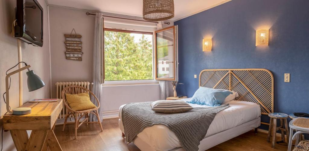 Postel nebo postele na pokoji v ubytování Hotel-Restaurant Le Sorgia