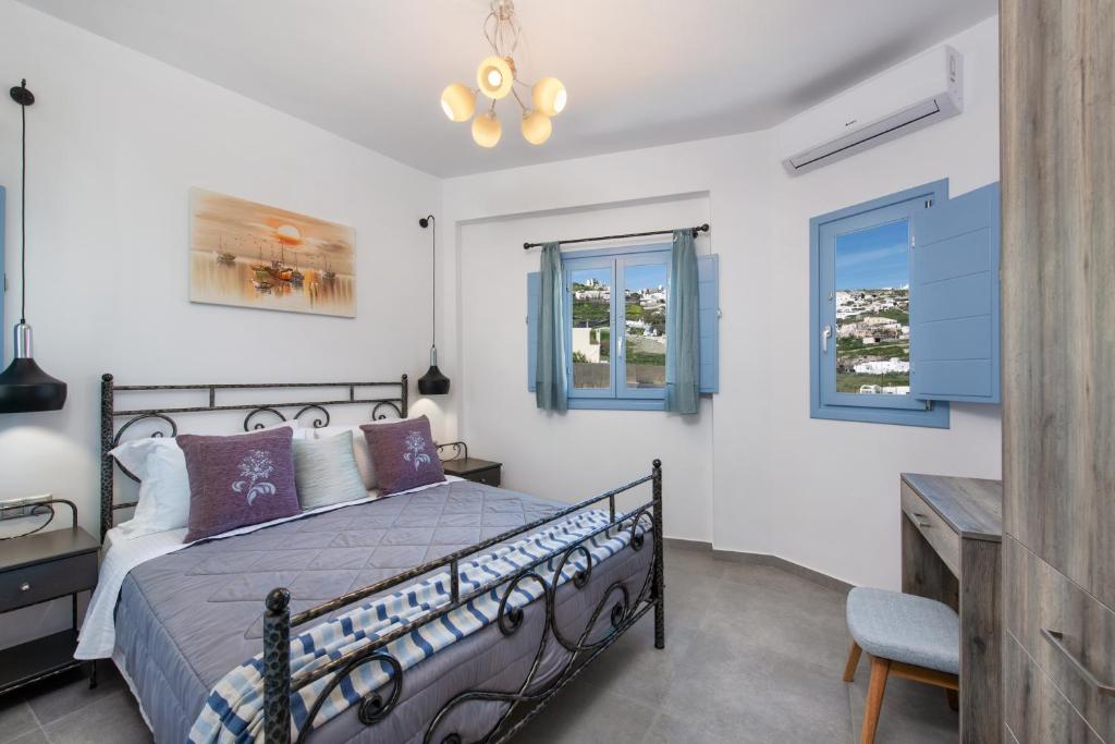 A bed or beds in a room at La Boheme Villas