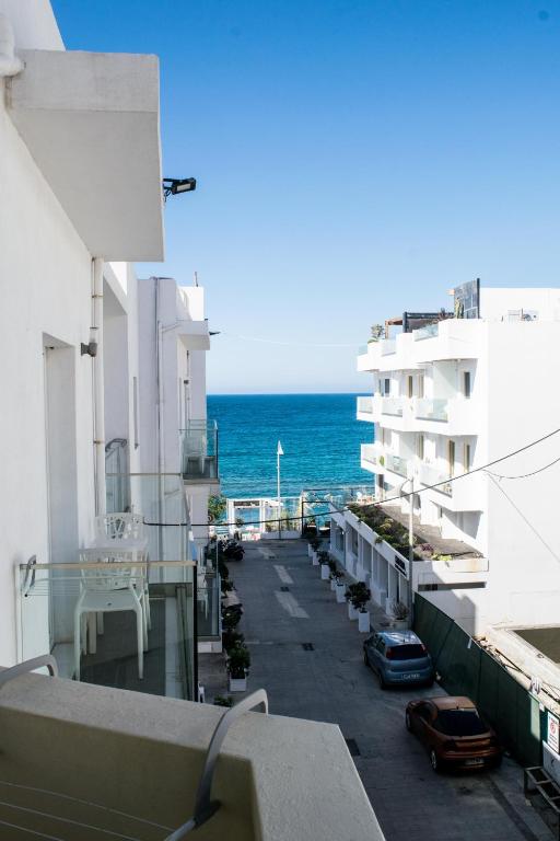 a view of the ocean from the balcony of a building at Greta Apartments in Hersonissos