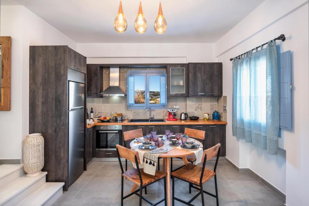 A kitchen or kitchenette at La Boheme Villas