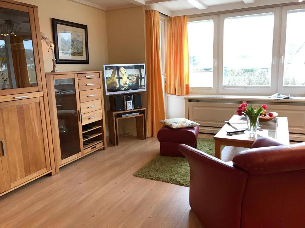 TV a/nebo společenská místnost v ubytování Gästehaus Friedeburg